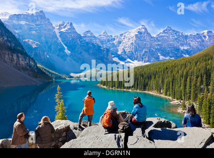 Tourists looking at Moraine lake in the Valley of the Ten Peaks Banff national park Alberta Canada Stock Photo