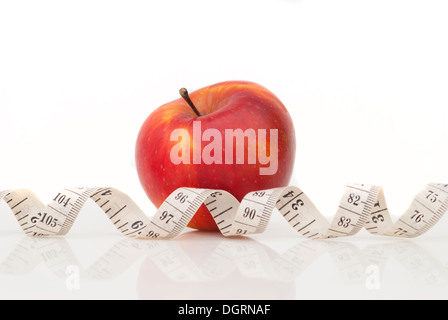 Red apple and measuring tape Stock Photo