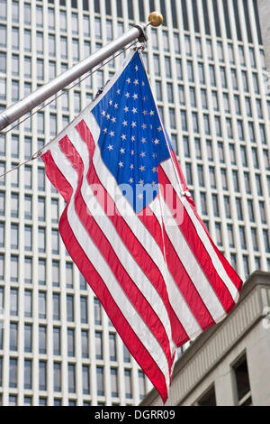 American flag hanging from a pole Stock Photo