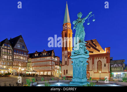 Roemerberg square with the Fountain of Justice or Justitia Fountain with a bronze statue of Justitia in front of St. Nicholas Stock Photo