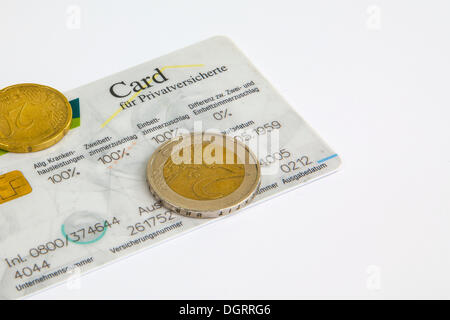 Health insurance card with euro coins, symbolic image for cost increases for private health insurance Stock Photo