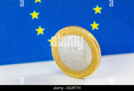 Old Greek 1 Euro coin in front of the flag of the European Union Stock Photo