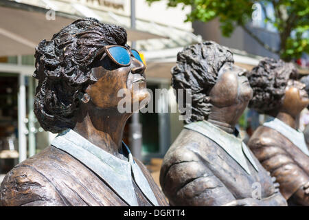 Bronze figures, one wearing sunglasses, looking up, Balingen, Baden-Wuerttemberg, PublicGround Stock Photo