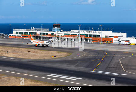 Airbus from easyjet.com in front of the terminal of Madeira Airport, LPMA, also known as Funchal Airport and Santa Catarina Stock Photo
