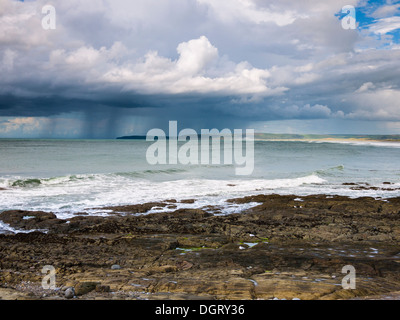 Summer rainstorm over Baggy Point viewed from Westward Ho! beach on the North Devon coast, England. Stock Photo