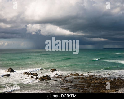 Summer rainstorm over the Atlantic Ocean viewed from Cornborough range on the North Devon coast near Abbotsham, England. Stock Photo