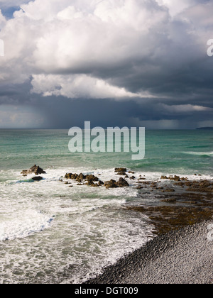 Summer rainstorm over the Atlantic Ocean viewed from Cornborough range on the North Devon coast near Abbotsham, England. Stock Photo