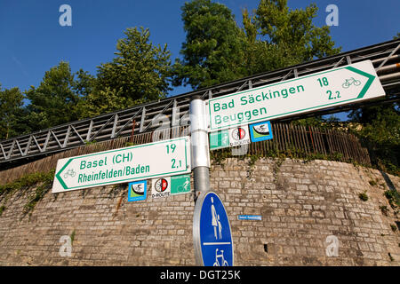 Signpost for walkers and cyclists on the Rhine river, near the Rheinfelden power station, Rheinfelden - Baden Stock Photo