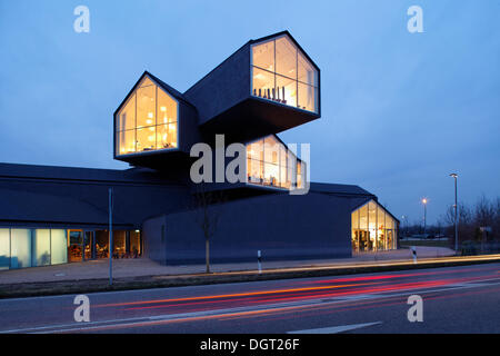 Vitra Haus building, by Herzog & de Meuron, evening mood, with traffic speeding by, architectural park of the Vitra company Stock Photo