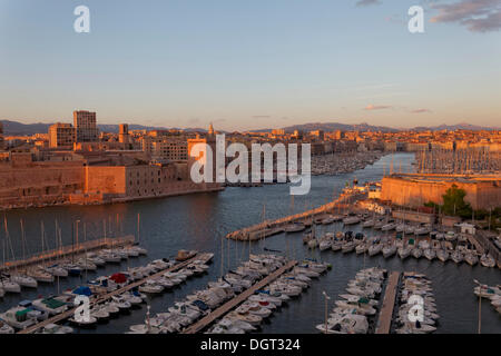 Entrance of the old harbour with Fort Saint-Jean, left, and Fort Saint-Nicolas, right, evening mood, historic center, Marseille, Stock Photo