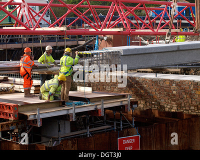 Construction workers put in new bridge, Bude, Cornwall, UK Stock Photo