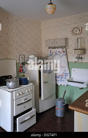 Kitchen of the 1950s with a stove, a refrigerator, a sink and a hot water boiler, industrial museum, Lauf, Middle Franconia Stock Photo