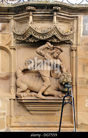 High-relief of St. George and the Dragon as a well figure on the Gothic Fischbrunnen fountain, built in 1509 by the Haller