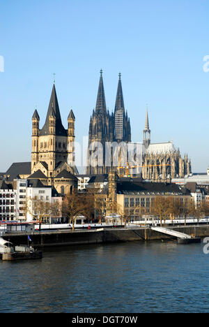 Frankenwerft in winter, in the back the church Gross St. Martin and the Cologne Cathedral, old town on the Rhine river, Cologne Stock Photo