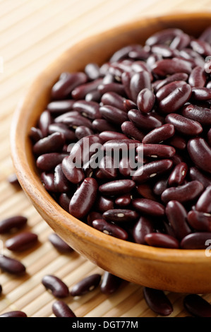 Wooden bowl full of purple kidney beans Stock Photo