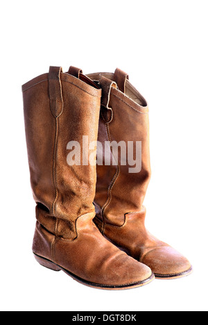 A studio shot of a pair of worn brown leather boots Stock Photo
