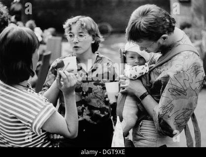 Young people with a baby, East Germany, German Democratic Republic, GDR, about 1984 Stock Photo