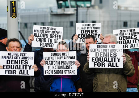 Belfast, Northern Ireland, UK. 25th Oct 2013.  Loyalists hold banners saying 'George Best Belfast City Airport denies equality for all' and 'Platform provided to nationalists from Short Strand' Credit:  Stephen Barnes/Alamy Live News Stock Photo