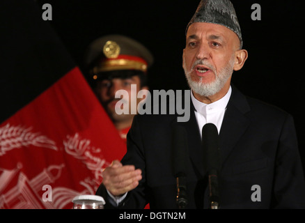 Afghan President Hamid Karzai holds a press conference after talks on the bilateral security agreement with U.S. Secretary of State John Kerry at the Presidential Palace October 12, 2013 in Kabul, Afghanistan. Stock Photo