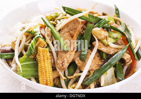 chicken with vegetables fried in wok Stock Photo