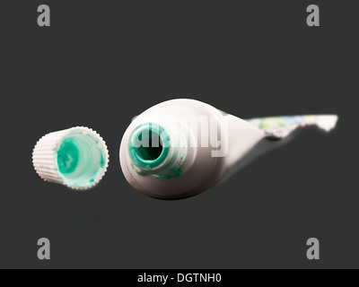 empty toothpaste on gray background Stock Photo