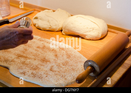 Making cinnamon buns Stock Photo