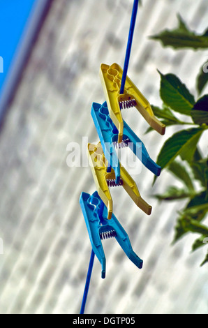 line with pegs against the blue sky Stock Photo