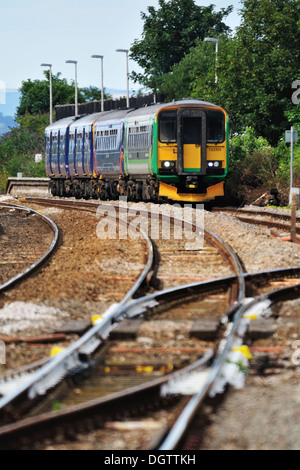 A local regional passenger train operated by First Great Western leaves Dawlish Warren Station Stock Photo