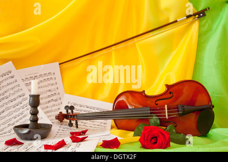 Viola with red roses on notes sheet Stock Photo