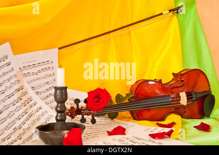 Viola with red roses on notes sheet Stock Photo