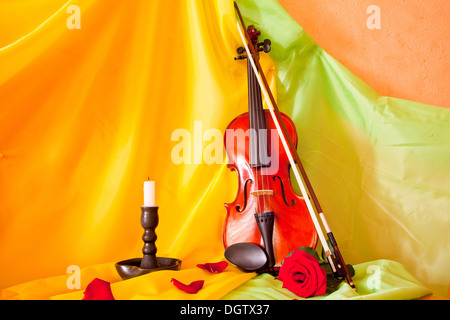 Viola with red roses on notes sheet Stock Photo