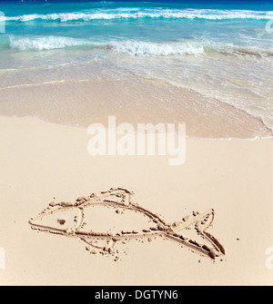 Children's picture on sand-  a small fish Stock Photo