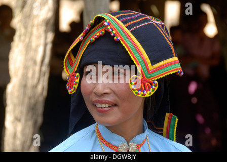 Portrait of a woman of the Tai Dam ethnic group wearing traditional clothing and indigo-coloured scarf with brightly embroidered Stock Photo