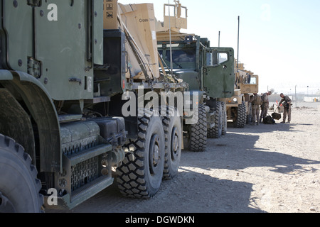 U.S. Marines with Headquarters and Support Company, 1st Battalion, 9th Marine Regiment, prepare for a convoy from Camp Leatherneck to Patrol Base Boldak, Helmand province, Afghanistan, Oct. 18, 2013. The convoy was conducted to resupply PB Boldak. Stock Photo