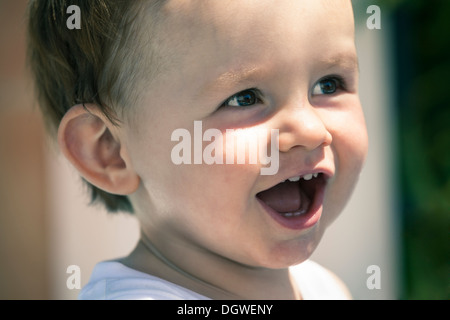 Closeup of happy baby boy face laughing. Stock Photo