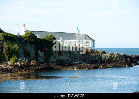 House on rocky outcrop Bull Bay Anglesey North Wales UK Stock Photo