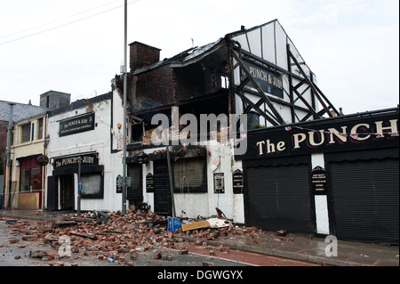 Gas Explosion and fire at Pub Public house walls demolished bricks strewn blown across road Stock Photo