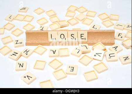 'Lose' written in scrabble tiles Stock Photo