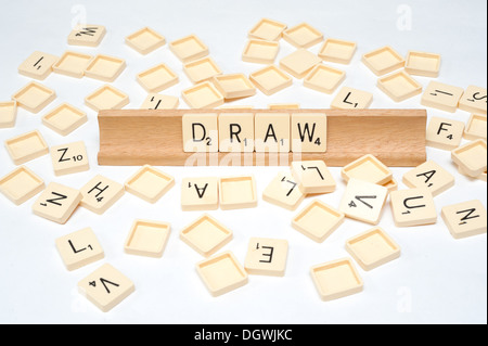 'Draw' written in scrabble tiles Stock Photo