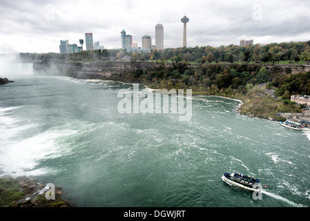 NIAGARA, NY - The Maid of the Mist carrying tourists sets off at Niagara Falls on the Niagara River on the border between the United States and Canada. Stock Photo