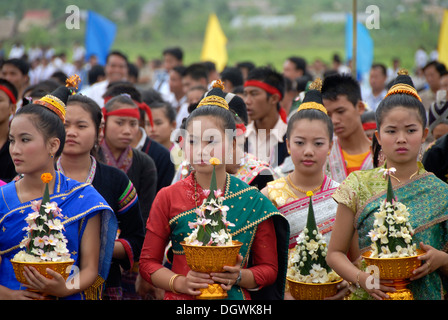 Festival, women of the Lao Loum ethnic group with sacrificial bowls ...