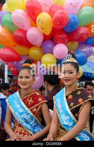 Festival, women of the Lao Loum ethnic group with sacrificial bowls ...