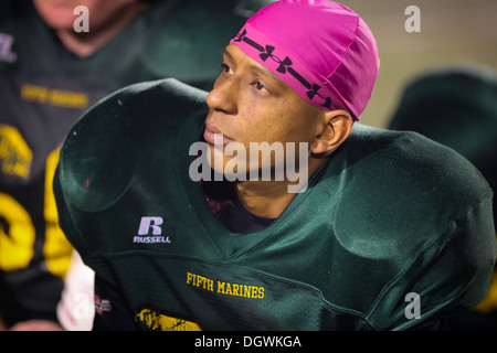 Sergeant Ricardo Ramirez, squad leader, 3rd Battalion, 5th Marine Regiment, competes on the Fighting Fifth's football team here, Oct 21, 2013, overcoming the loss of his hand during combat operations during Operation Iraqi Freedom, 2006. He plays cornerba Stock Photo