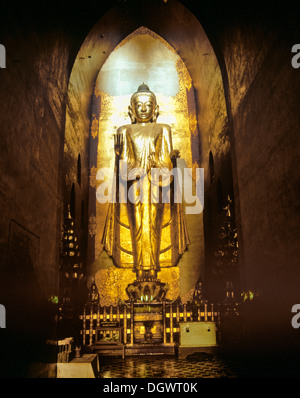 Golden Buddha standing inside of Ananda temple in Bagan Stock Photo - Alamy