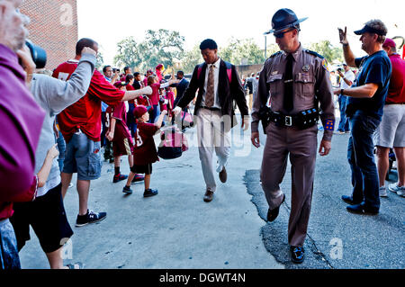 October 26, 2013: Florida State Seminoles quarterback Jameis Winston greets fans as he walks with a police escort into the stadium before the start of the game between the NC State Wolfpack and the Florida State Seminoles at Doak S. Campbell Stadium. Stock Photo