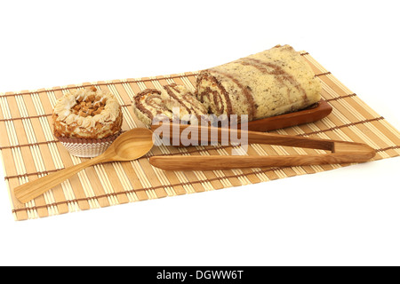 Sponge cakes - walnut roll and cake isolated on white background Stock Photo