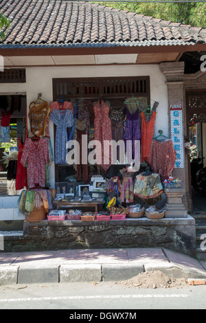 Clothes shop souvenirs gifts Ubud Bali Indonesia Asia color colorful items tourists attraction destination presents traditional Stock Photo