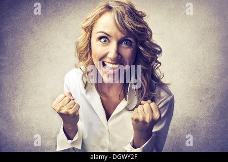 Blonde woman rejoicing Stock Photo