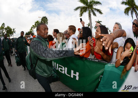 Miami, FL, USA. 26th Oct, 2013.  Duke Johnson #8 of the Miami Hurricanes is greeted by fans before the NCAA football game between the Miami Hurricanes and Wake Forest Demon Deacons in Miami Gardens, Florida. The Hurricanes defeated the Demon Deacons 24-21. © Cal Sport Media/Alamy Live News Stock Photo