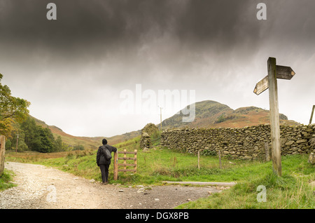 Signpost indicating the path up mount Helvelyn, Cumbria, Lake District, England. Stock Photo